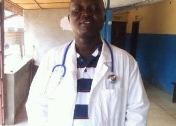Man in white medical coat with stethoscope accused of posing as a doctor in Liberia murder indictment case