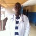 Man in white medical coat with stethoscope accused of posing as a doctor in Liberia murder indictment case