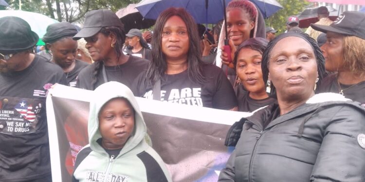 WONGOSOL Executive Director Esther Davis Yango and citizens protest at the Capitol, calling for stronger action against drug trafficking in Liberia.