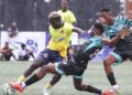 Free Port FC player battles Watanga defenders during Bettomax Champions Cup opener in Gardnersville, Liberia.