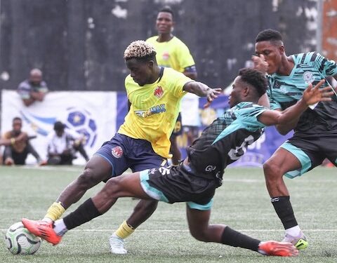 Free Port FC player battles Watanga defenders during Bettomax Champions Cup opener in Gardnersville, Liberia.