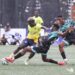 Free Port FC player battles Watanga defenders during Bettomax Champions Cup opener in Gardnersville, Liberia.