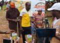 Billionaire Drap Tap Foundation outreach team handing supplies to community members in Grand Bassa County