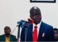 EPA Executive Director Dr. Emmanuel Yarkpawolo announces fines against major companies for pollution and illegal waste disposal during a press briefing in Monrovia.