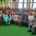Group photo of government officials, development partners, and adolescent leaders at the Adolescent Girls Conference in Monrovia, Liberia