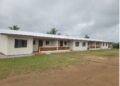 Renovated AFL barracks and nearby civilian homes in Kakata, Margibi County, at the center of a land reclamation dispute that has left dozens facing eviction.