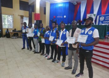 Group of Bong County financial education trainers holding certificates during the CBL PAPSS campaign launch in Gbarnga, Liberia.