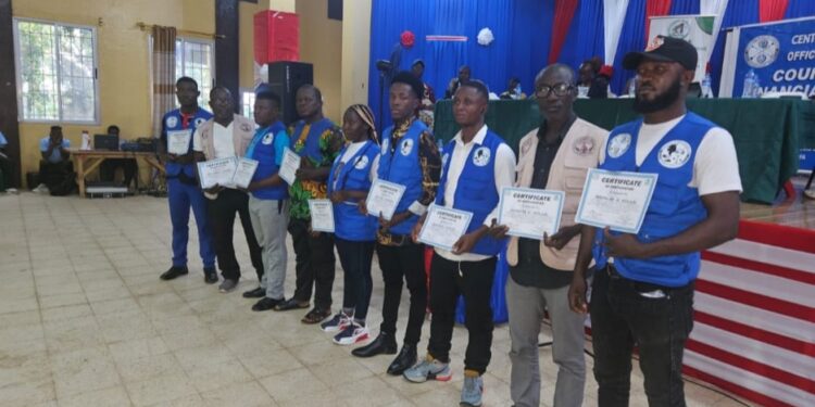 Group of Bong County financial education trainers holding certificates during the CBL PAPSS campaign launch in Gbarnga, Liberia.