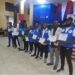 Group of Bong County financial education trainers holding certificates during the CBL PAPSS campaign launch in Gbarnga, Liberia.