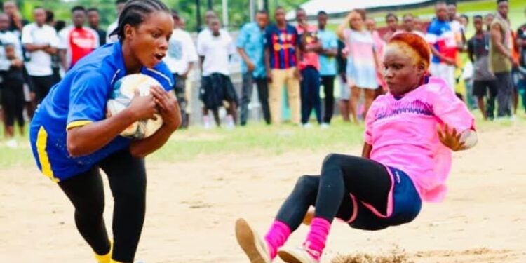 Liberian female kickball players in action during an exhibition match as Sierra Leone endorses the sport.