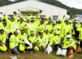 Group of commercial motorcyclists in Yekepa wearing new reflective jackets and helmets provided by ArcelorMittal Liberia during road safety training