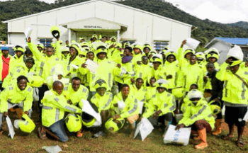 Group of commercial motorcyclists in Yekepa wearing new reflective jackets and helmets provided by ArcelorMittal Liberia during road safety training