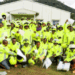 Group of commercial motorcyclists in Yekepa wearing new reflective jackets and helmets provided by ArcelorMittal Liberia during road safety training