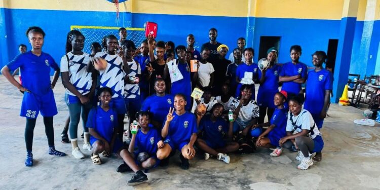 Liberian youth handball players at the Professional Sports Academy pose after training as PSA prepares for the 2026 Youth Olympics in Senegal.