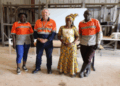 ArcelorMittal Liberia Training Academy manager Victor Loubser stands alongside community-relations officers and a local chief at the launch of the literacy and numeracy training program at Greenhill Quarry in Bong County to prepare residents for future mining jobs.