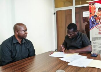 ArcelorMittal Liberia officials sign a three-year sponsorship agreement with the Liberia Marathon Trust in Monrovia, committing $30,000 annually.