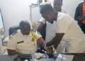 LDEA interim chief Fitzgerald Biago undergoes a drug test in Monrovia as part of new mandatory testing for all officers
