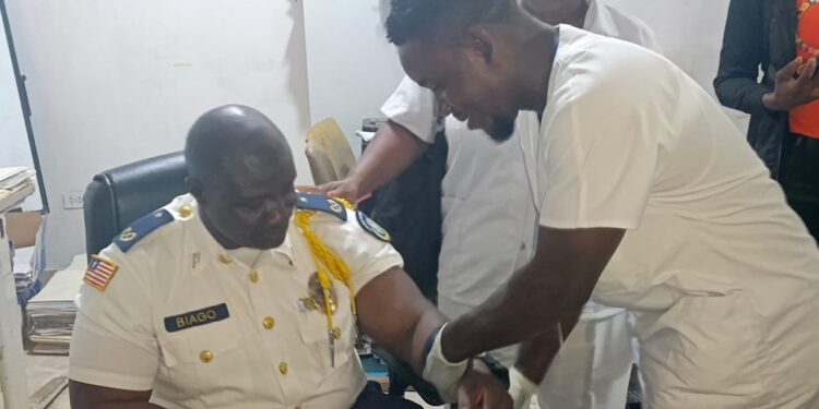 LDEA interim chief Fitzgerald Biago undergoes a drug test in Monrovia as part of new mandatory testing for all officers