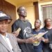 Anti-drug campaigners in black attire present a petition to Bong County authorities in Gbarnga, demanding tougher action against drug trafficking and abuse