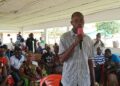 Emery Ciapha, Chief Officer of the Korninga ‘A’ Forest Community, speaks at a contract review meeting with residents in Gbarpolu.
