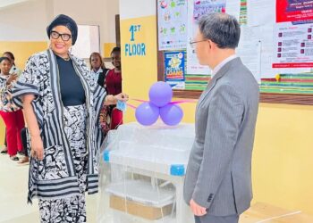 Chinese Ambassador Yin Chengwu and Health Minister Dr. Louise Mapleh Kpoto at donation ceremony for maternal health equipment in Liberia
