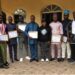 Community representatives in Cameroon hold certificates after forming Local Collaborative Management Committees to fight illegal fishing