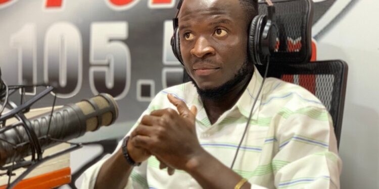 Emmanuel Kollie of the Liberia Broadcasting System, newly elected president of LEGISPOOL, speaking in studio after his victory