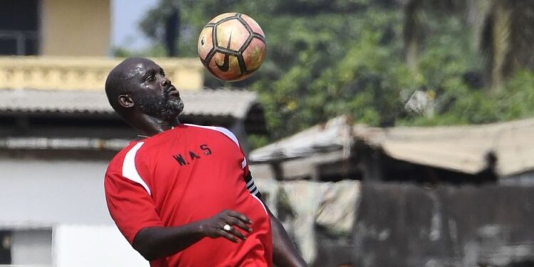 George Weah in training gear during his playing days, symbolizing his legendary football career despite his recent remarks about not being a fan