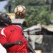 George Weah in training gear during his playing days, symbolizing his legendary football career despite his recent remarks about not being a fan