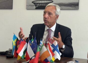 EU Sahel Envoy João Gomes Cravinho speaks in Monrovia with European and African flags on the table, warning Liberia of regional spillover risks.