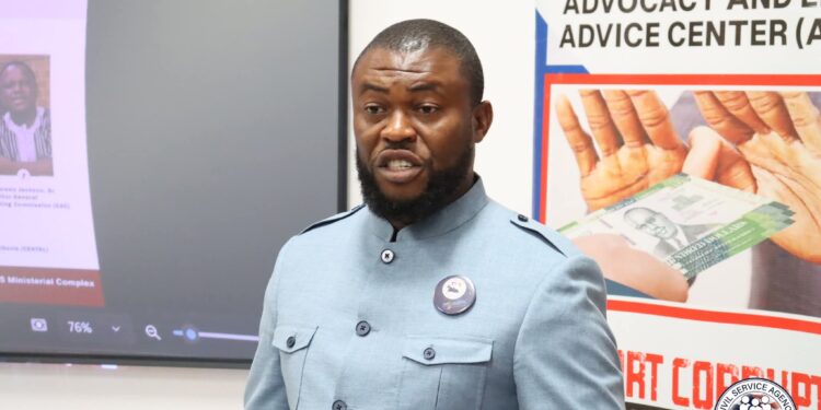 Civil Service Agency Director-General Josiah F. Joekai Jr. addresses reporters in Monrovia after warning public university faculty against a planned go-slow protest in Liberia.
