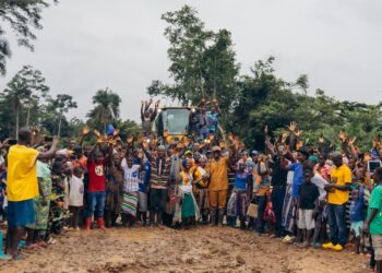 Citizens of Gou, Bong County, Liberia celebrate the launch of an 8-kilometer road project bringing connectivity, healthcare access, and new opportunities