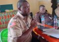 Liberia Immigration Service Deputy Comptroller Jacob Jallah speaking at a public event, now under fire for controversial remarks about drugs.