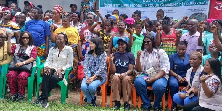World Bank Country Manager for Liberia Georgia Wallen and partners from Catholic Relief Services, Plan International, and ActionAid pose with women beneficiaries of the Liberia Women Empowerment Project in Zannah Town, Montserrado County, celebrating progress in rural women’s financial literacy, savings groups, and small enterprise development