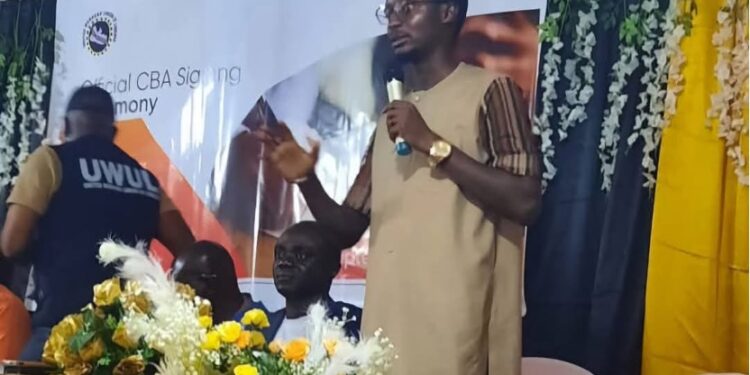 Assistant Labor Minister Emmanuel Barnes speaks during the signing of a Collective Bargaining Agreement between ArcelorMittal Liberia and the United Workers Union in Buchanan, Grand Bassa County.