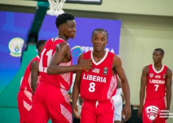 Liberia U-16 basketball players in red jerseys compete at the 2025 Afrobasket Youth Championship in Kigali, Rwanda