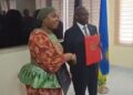 Liberian Foreign Minister Sara Beysolow Nyanti and Rwandan Foreign Minister Olivier Nduhungirehe sign visa-free and cooperation agreements in Monrovia.