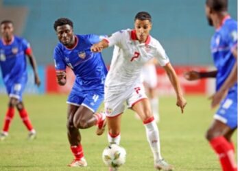 Tunisia and Liberia players battle for the ball during World Cup qualifier in Rades