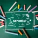 green board with nepotism written on it and chalks of different colors