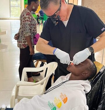 A healthcare worker providing free dental treatment during CARE Inc.’s weeklong outreach in Montserrado County, Liberia, which served over 5,000 residents.
