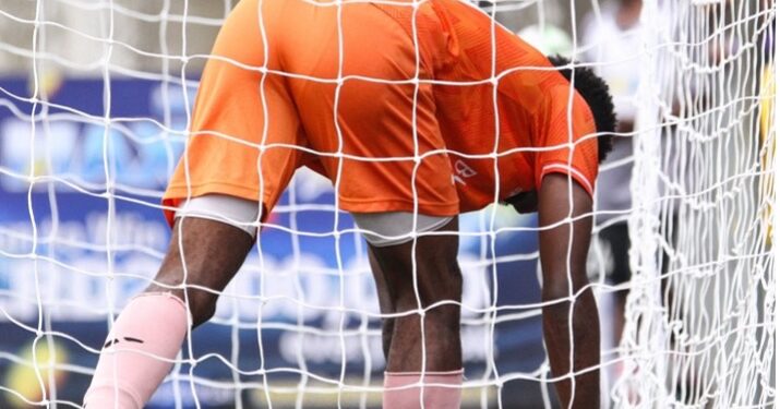 Blackman Warriors goalkeeper Onesimus Beyan retrieves the ball after a mistake