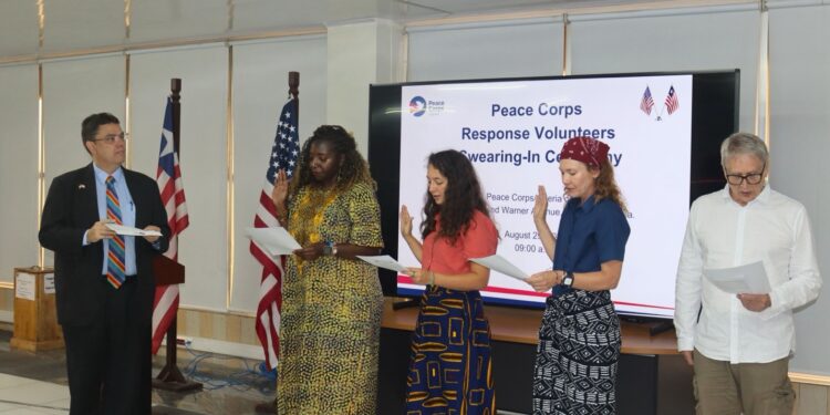 U.S. Embassy Chargé d’Affaires Joseph Zadrozny swears in four new Peace Corps Response Volunteers during a ceremony in Monrovia