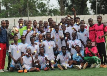 Youth football team celebrates during the Play For Peace Tournament in Monrovia, Liberia, as the event expands to include West African teams