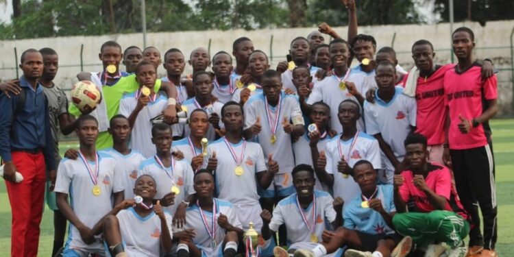 Youth football team celebrates during the Play For Peace Tournament in Monrovia, Liberia, as the event expands to include West African teams
