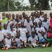 Youth football team celebrates during the Play For Peace Tournament in Monrovia, Liberia, as the event expands to include West African teams
