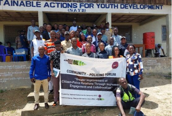 Community members, police, magistrates, and prison officials gather in Sanniquellie for a Rescue Alternatives Liberia awareness forum on criminal justice roles
