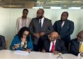 Liberian government officials and Atlas Oranto executives signing four offshore production-sharing contracts to revive Liberia’s petroleum sector at LPRA ceremony.