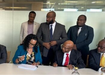 Liberian government officials and Atlas Oranto executives signing four offshore production-sharing contracts to revive Liberia’s petroleum sector at LPRA ceremony.