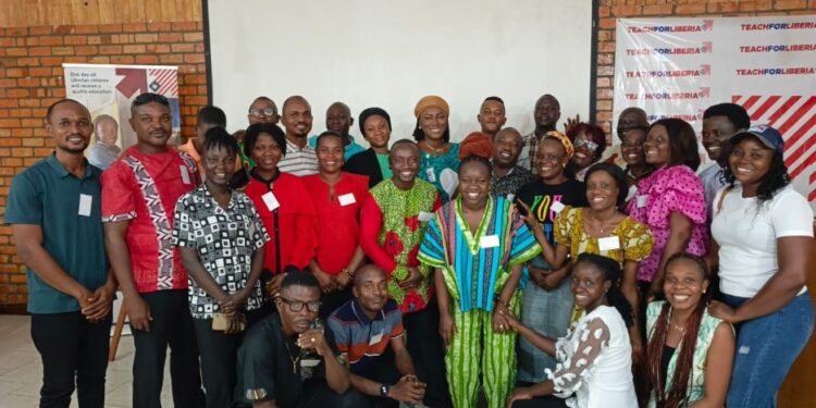 Teach For Liberia alumni and staff pose for a group photo during the organization’s first-ever alumni retreat in Monrovia