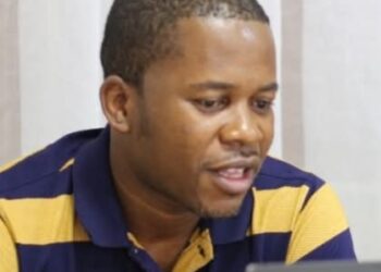 Former Liberia Chess Federation president Thomas Karyah speaking during an earlier meeting before resigning amid an escalating leadership feud.